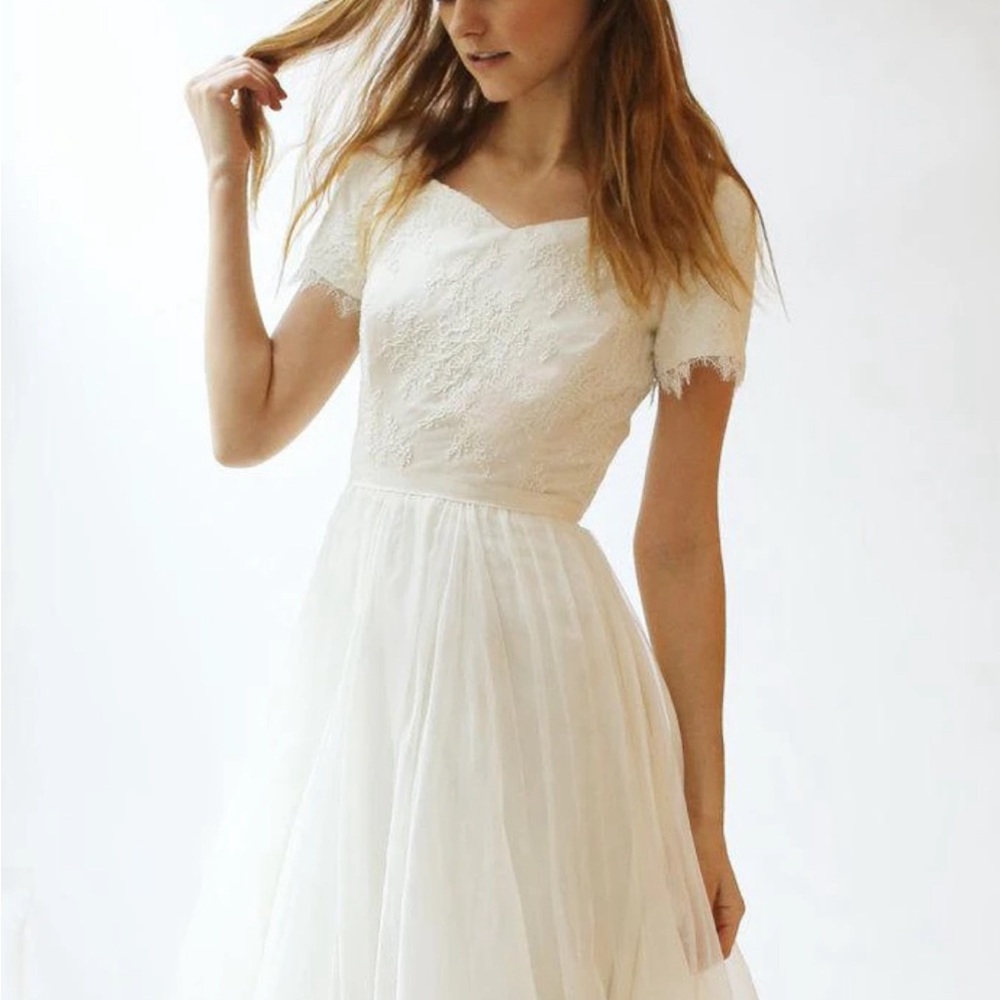 Beautiful modest wedding dress. Worn once. Dry cleaned. Bonus blue sash.